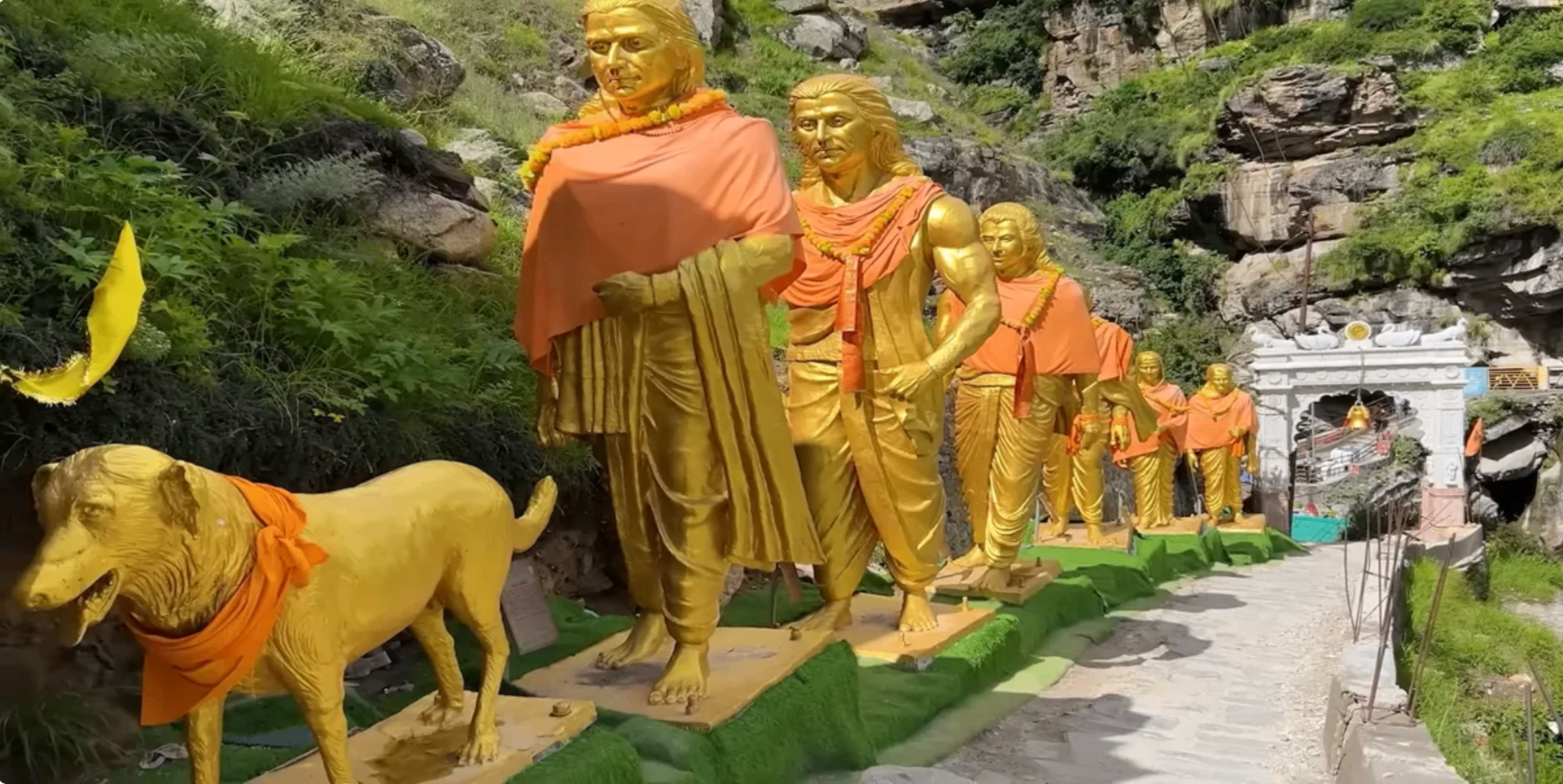 Monumental gilded sculptures of the Pandavas' ascent to heaven, installed at Mana Village near Badrinath Dham — sculpted by Dilip Rohom