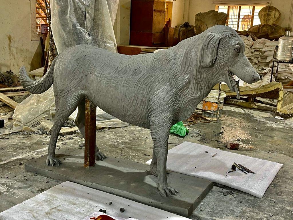 Clay sculpture of the faithful dog from the Pandavas' ascent — work in progress in the Dilip Rohom studio